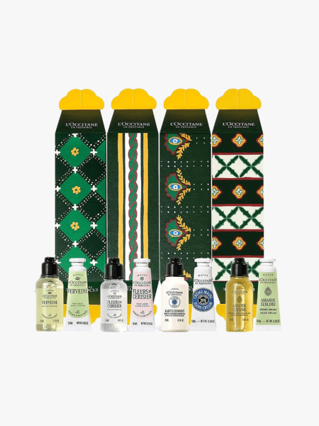 L’Occitane Festive Crackers Holiday Beauty Gift Set in multiple branded components on a light gray background