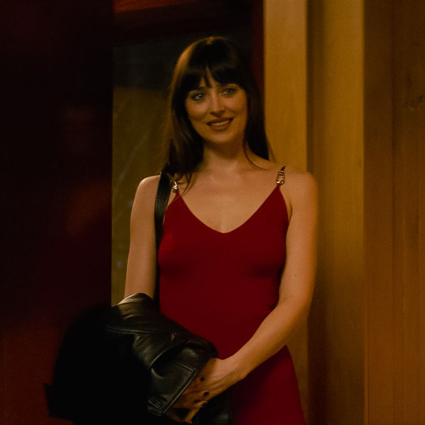 Dakota Johnson stars as Lowen Ashleigh in director Michael Showalter's VERITY. In this still Lowen wears a red dress and...